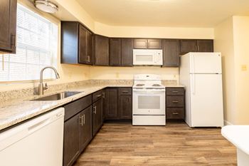 Modern kitchen with stainless steel appliances and double door refrigerators